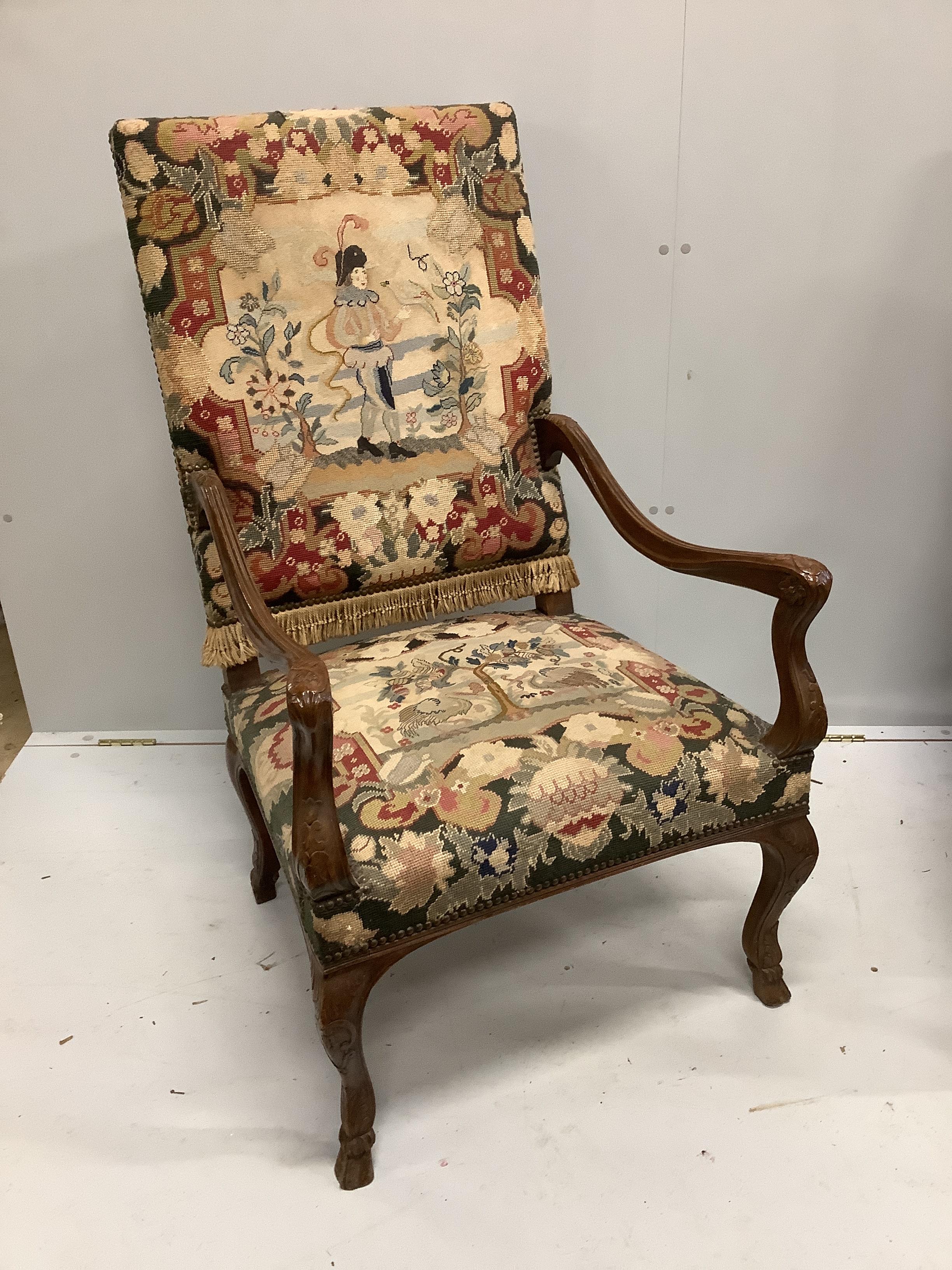 An 18th century style French upholstered walnut settee, length 116cm, width 66cm, height 112cm together with and a matching armchair